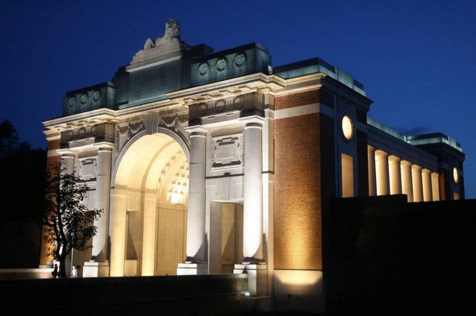 A building with a large archway Description automatically generated with medium confidence