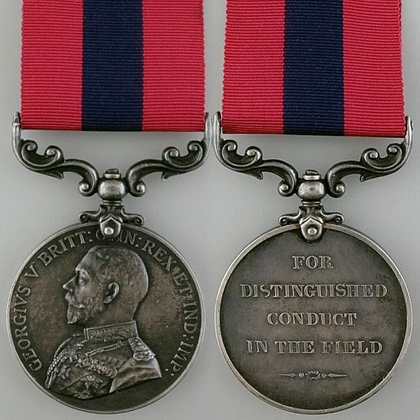 A close-up of a medal Description automatically generated