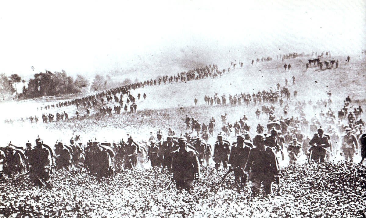A large group of people walking on a hill Description automatically generated